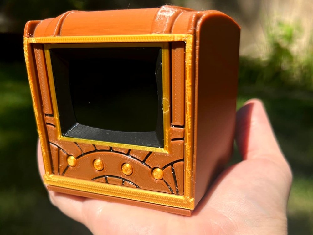 The Pict-O-Vision Still resting in one open palm, showing it fits in a hand